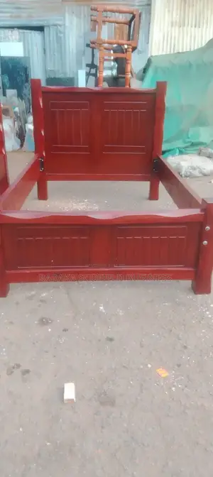 Dark Brown Hardwood Panel Bed Frame With a Plain Plywood Mattress Base