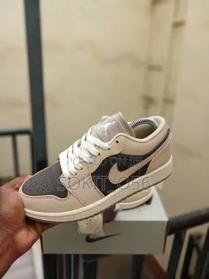 Air Jordan 1 Low SE Sneakers in a Cream-and-Brown/Mocha Colorway.