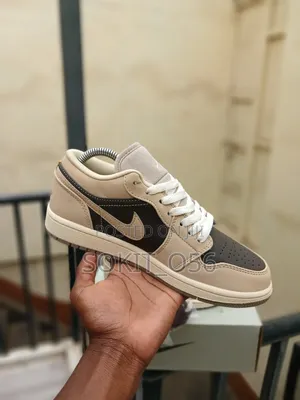Air Jordan 1 Low SE Sneakers in a Cream-and-Brown/Mocha Colorway.