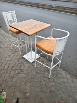 Restaurant White Chairs and Mahogany Table
