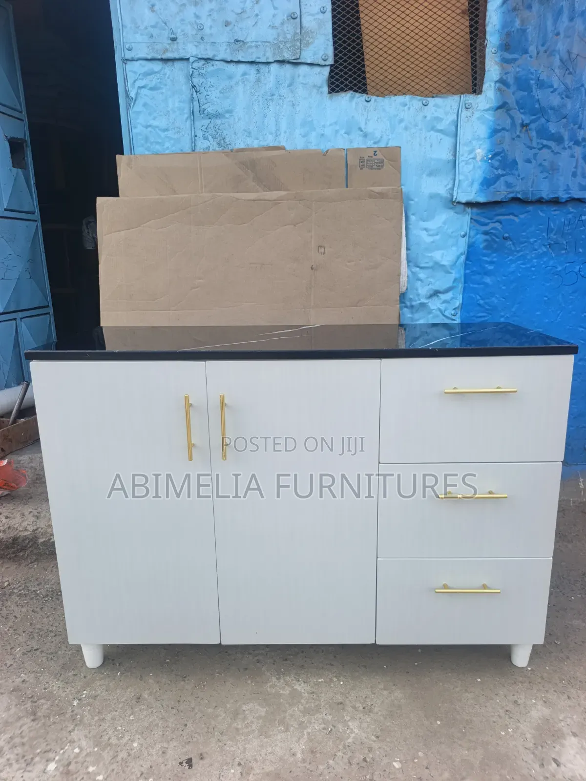 White Kitchen Cabinet With Black Marble Top