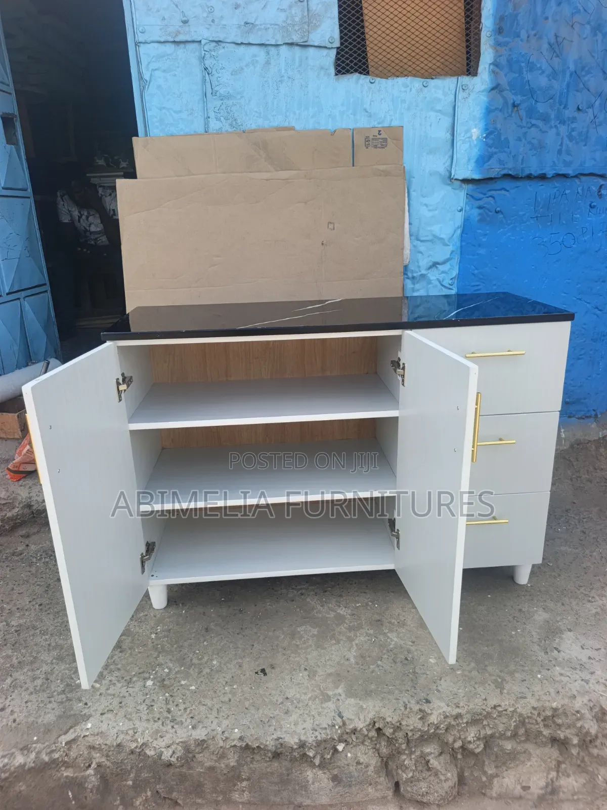 White Kitchen Cabinet With Black Marble Top