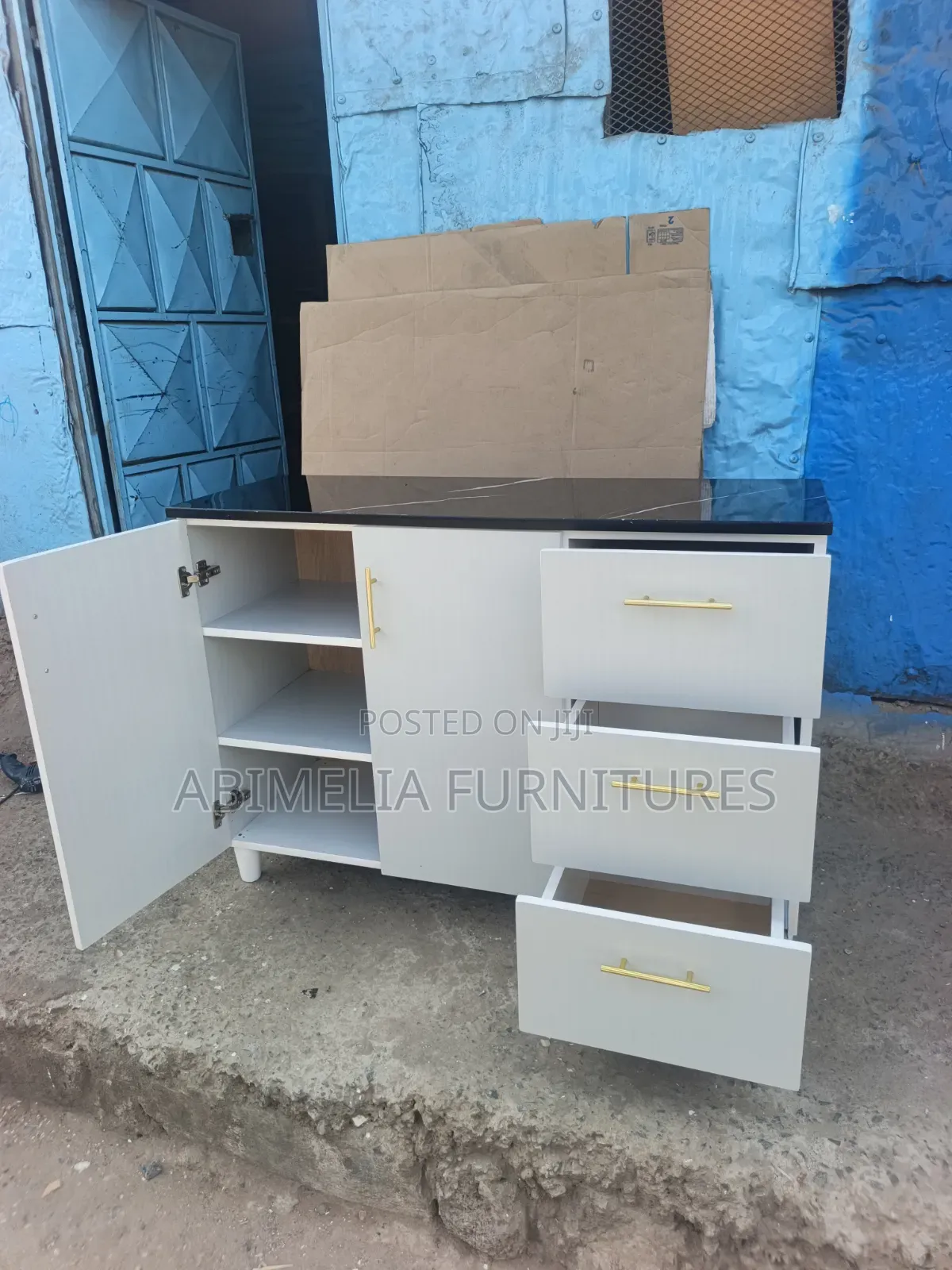 White Kitchen Cabinet With Black Marble Top