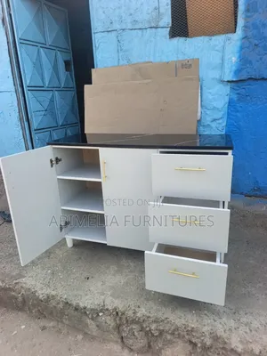 White Kitchen Cabinet With Black Marble Top