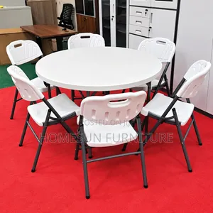Round Folding Table With 6 White Chairs