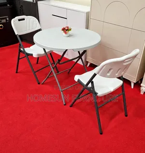 Round Folding Table With 2 White Chairs