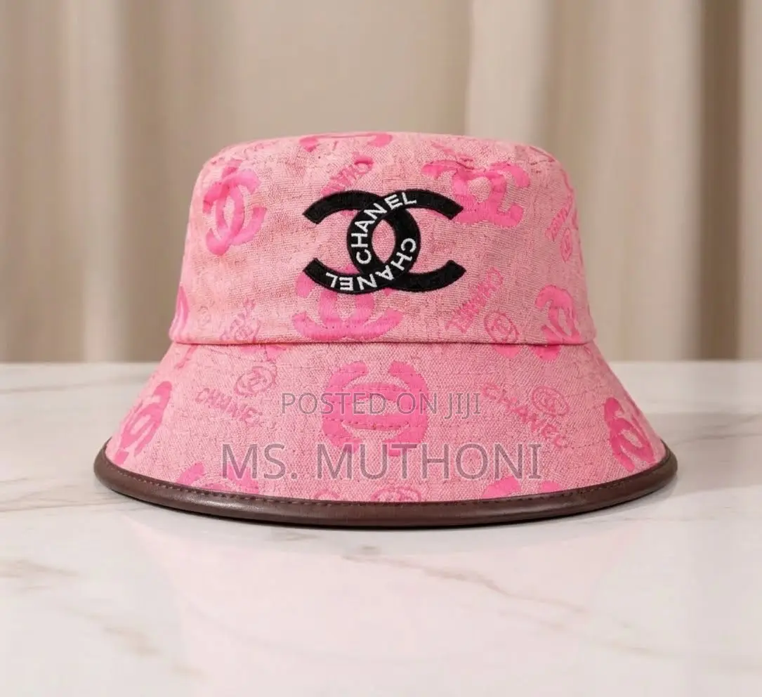 Monogrammed Chanel Canvas Bucket Hats Styled With Leather Trims.