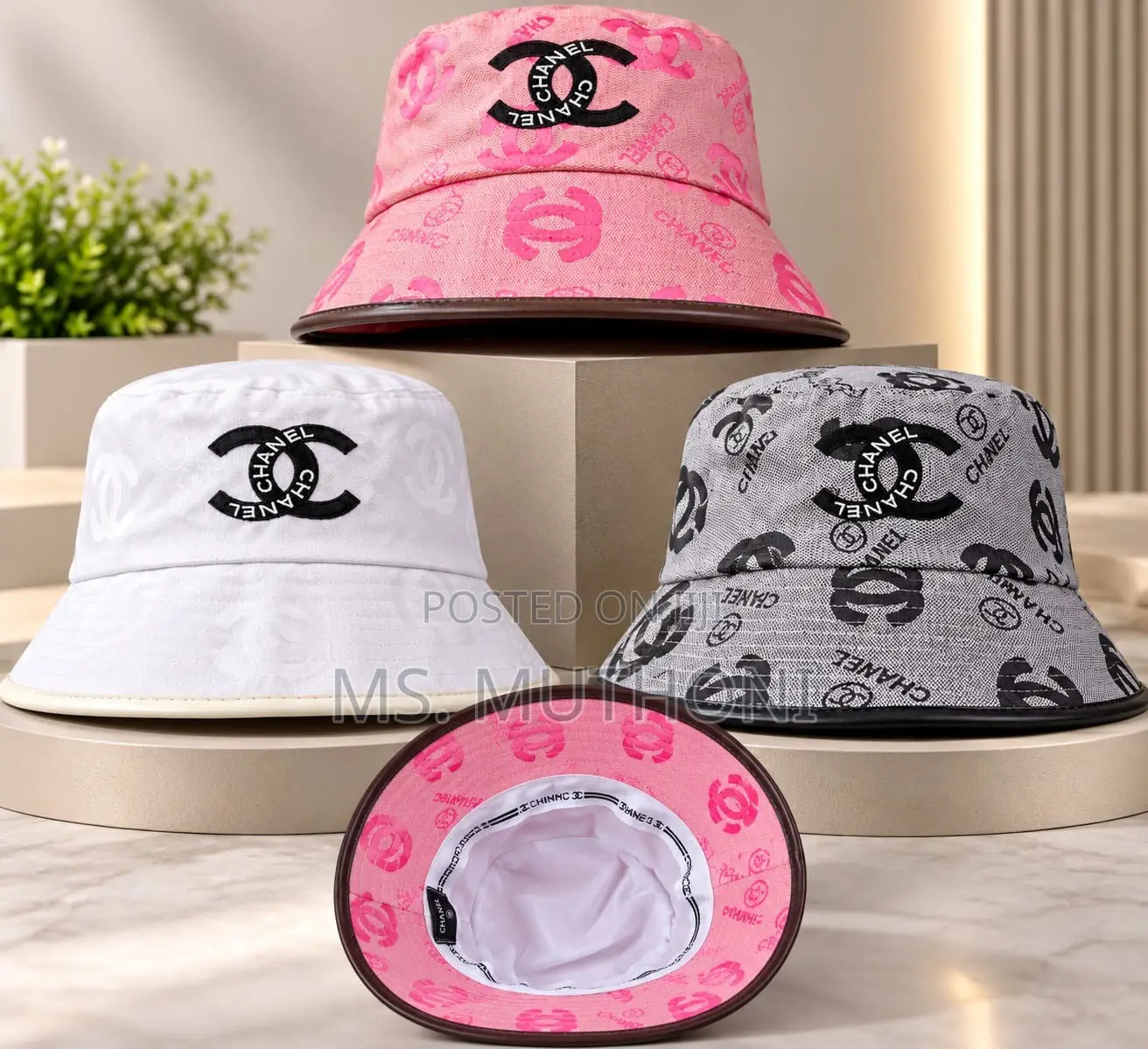 Monogrammed Chanel Canvas Bucket Hats Styled With Leather Trims.