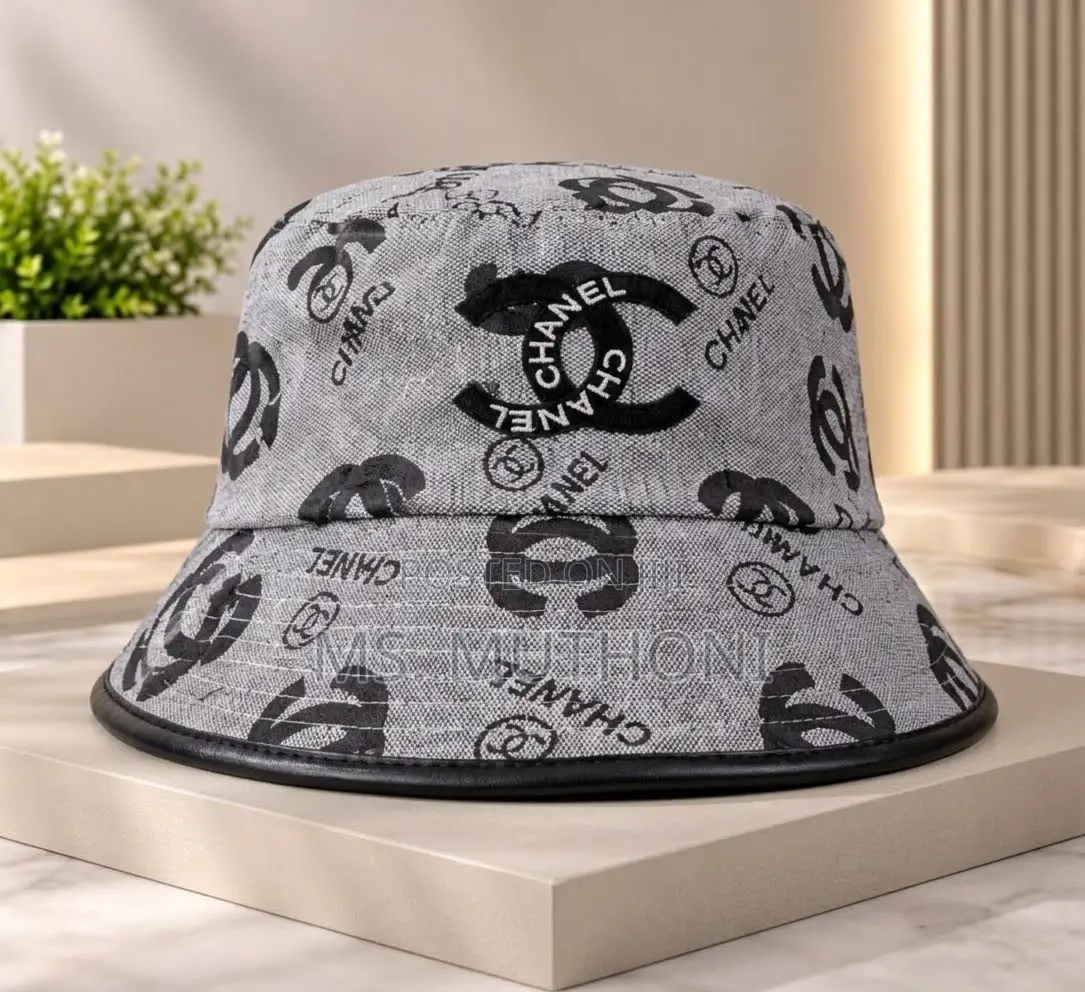 Monogrammed Chanel Canvas Bucket Hats Styled With Leather Trims.