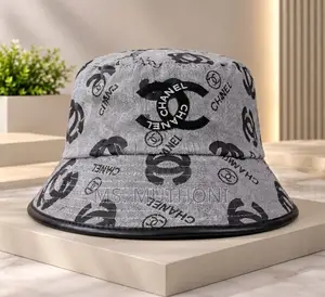 Monogrammed Chanel Canvas Bucket Hats Styled With Leather Trims.