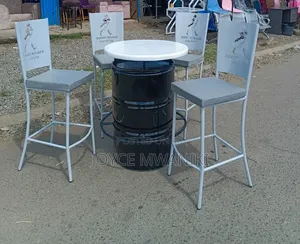 Antique White Coated Bar Chairs With a Black Drum Table