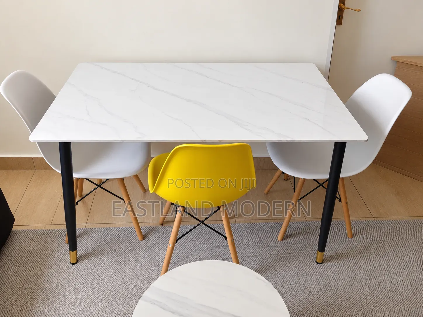 White Marble Dining Table With Eames Chairs