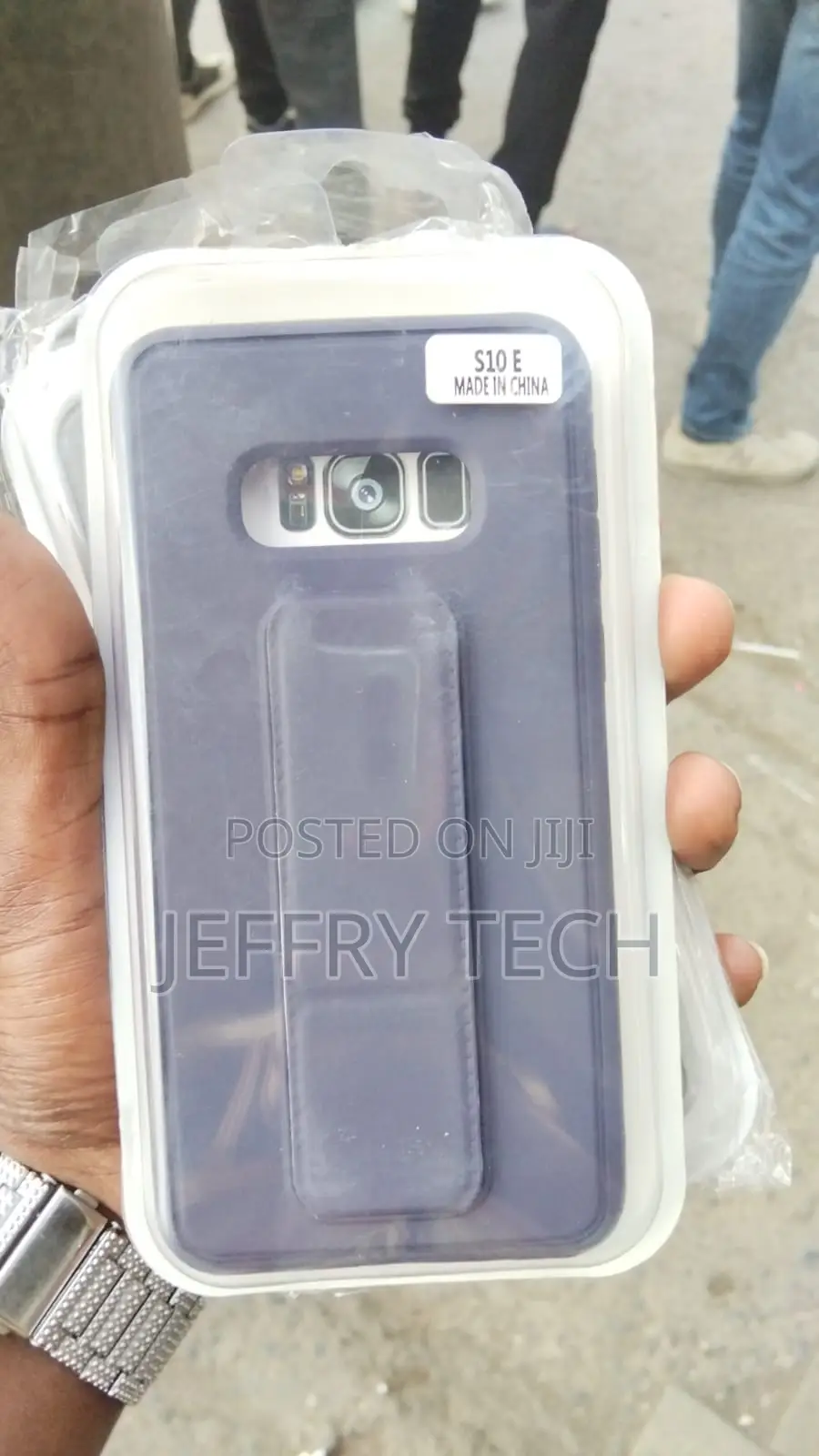 Grey and White Phone Case Inside Plastic With a Sticker That S10E