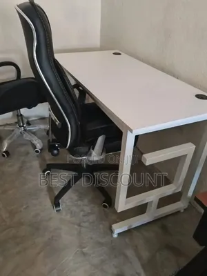 Black and White Office Desk With Ergonomic Chair