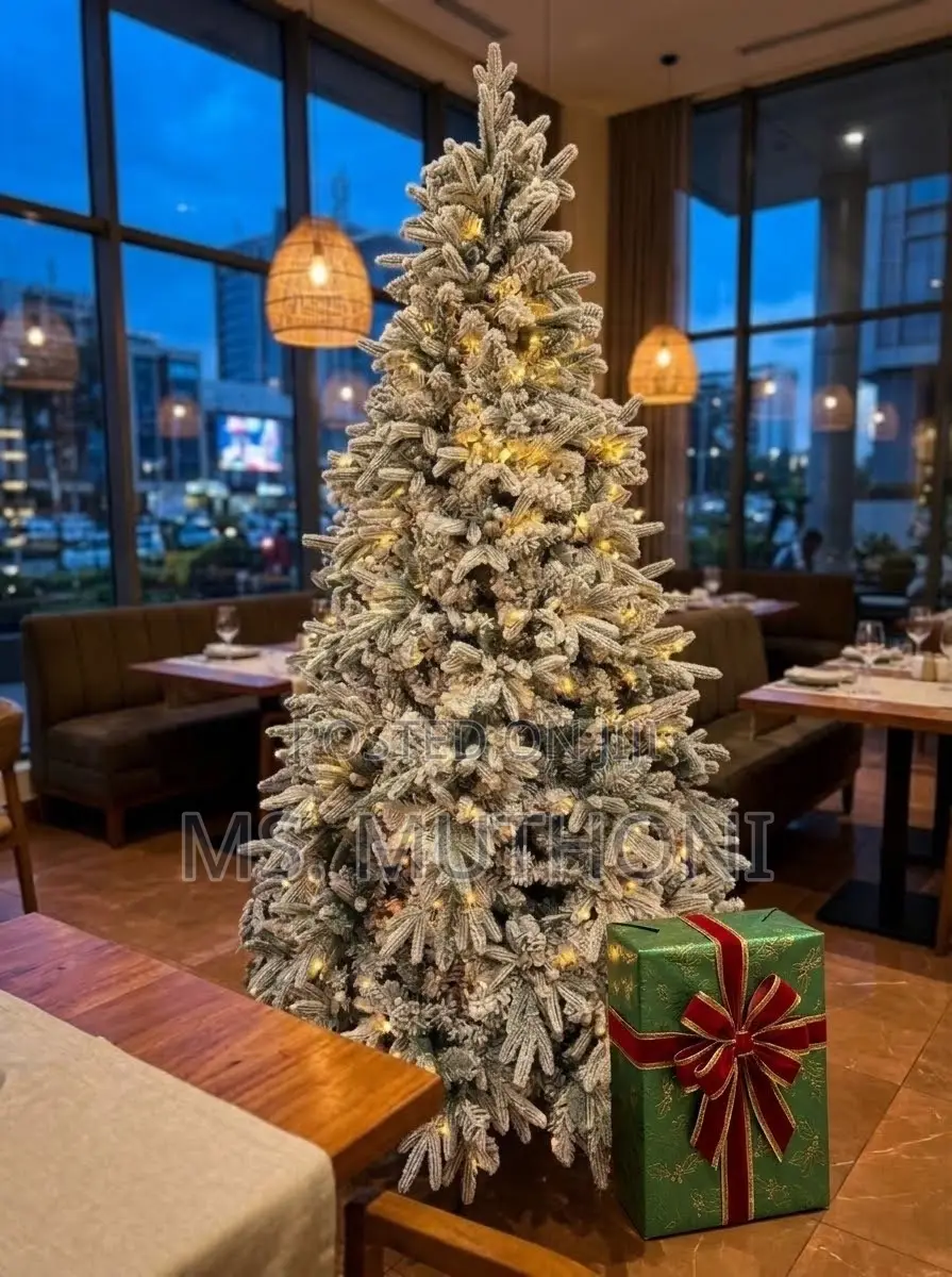 Snow-Flocked Pre-Lit Christmas Tree With Warm White LED Lights.