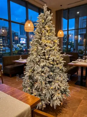 Snow-Flocked Pre-Lit Christmas Tree With Warm White LED Lights.
