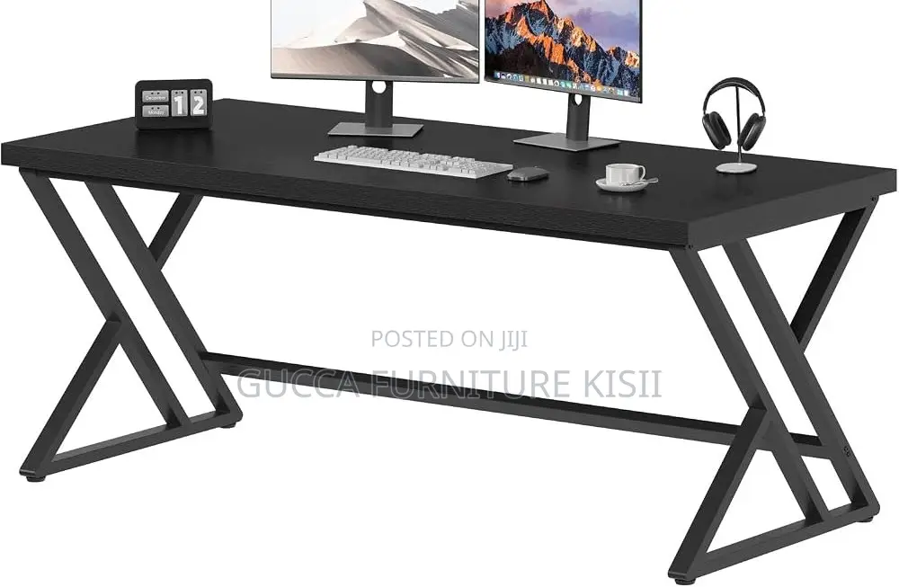 Black Computer Desk With Ergonomic Metallic Legs.