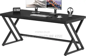 Black Computer Desk With Ergonomic Metallic Legs.