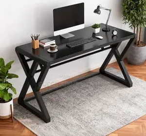 Black Computer Desk With Ergonomic Metallic Legs.