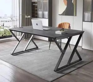 Black Computer Desk With Ergonomic Metallic Legs.