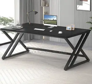 Black Computer Desk With Ergonomic Metallic Legs.