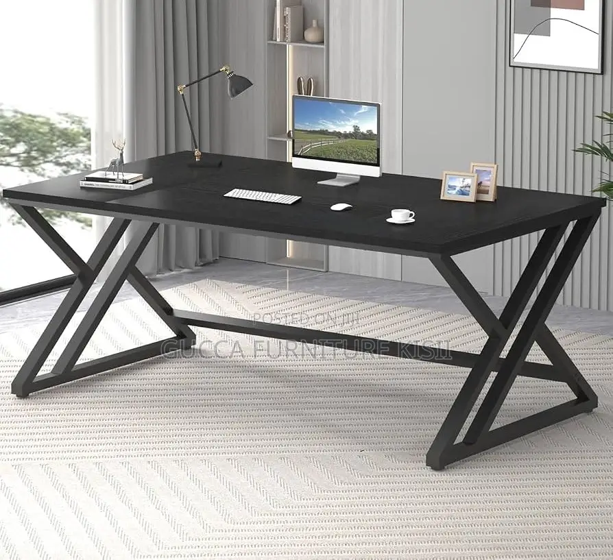 Black Computer Desk With Ergonomic Metallic Legs.