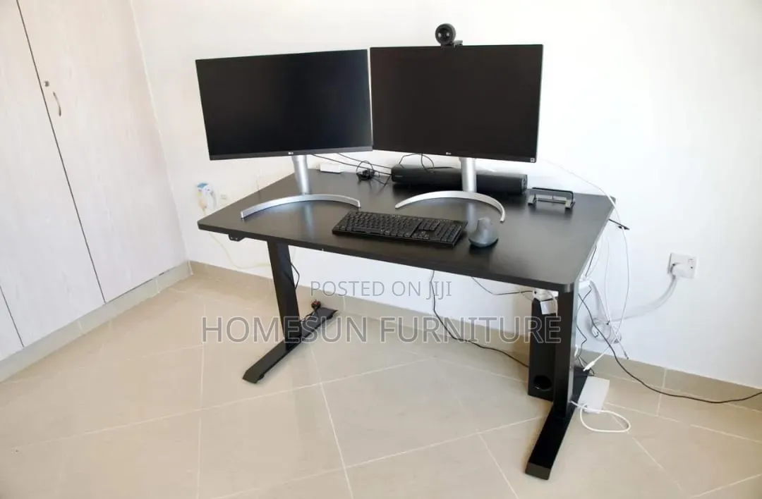 Electric Standing Desk With Black Top and T-Shaped Legs