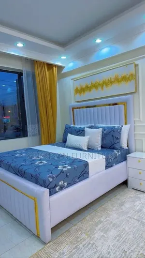 ​Luxury White Vertical Channel-Tufted Bed Frame With Gold Accents