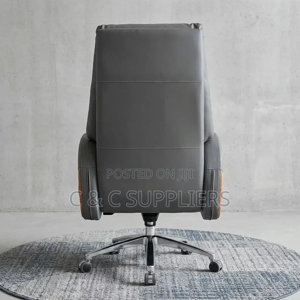 Leather Director's Seat With Footrest.