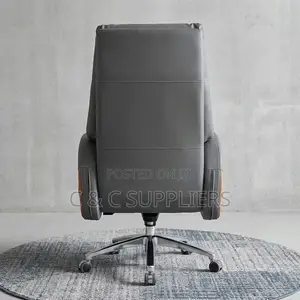 Leather Director's Seat With Footrest.