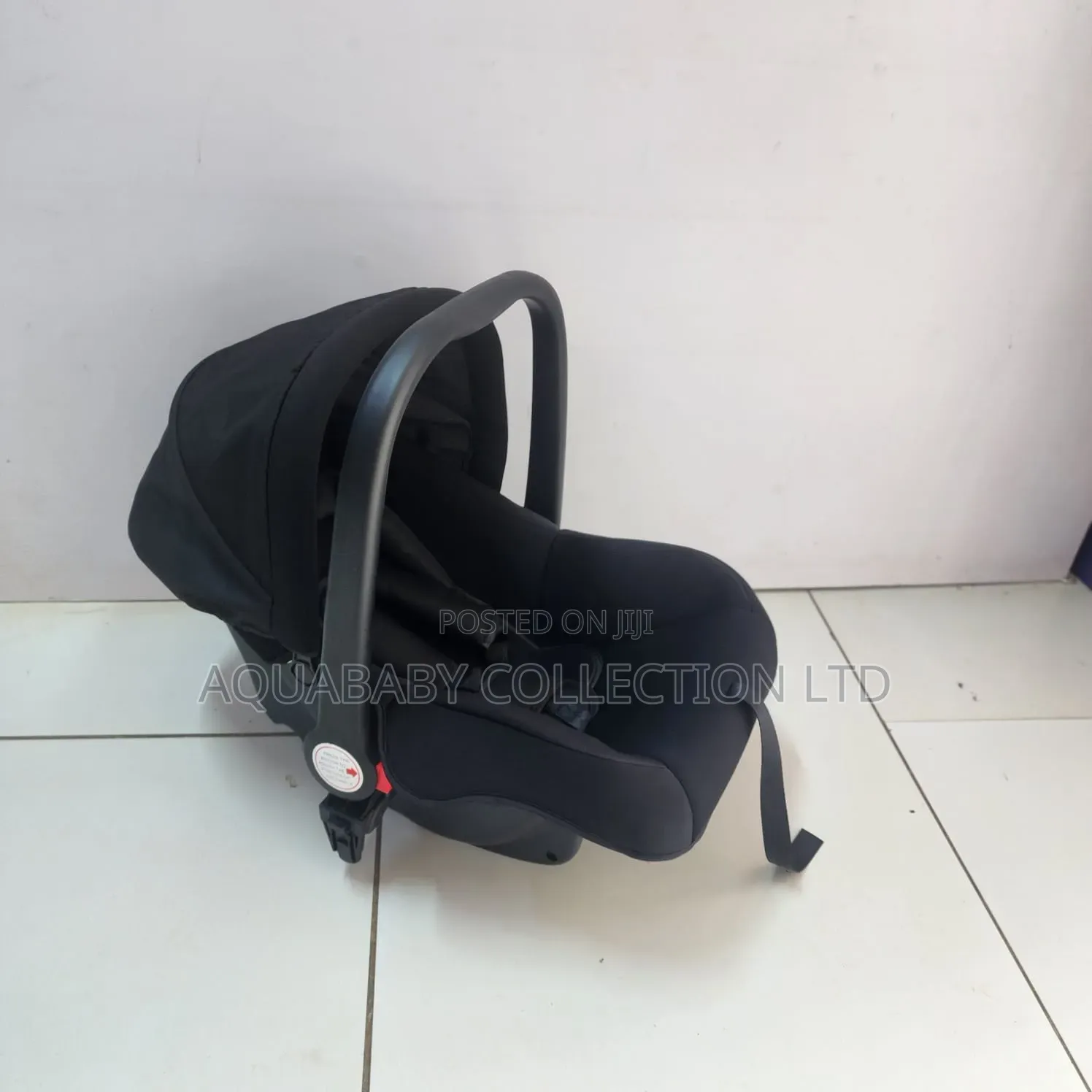 Black Carrycot, an Infant Carseat, and a Rocker