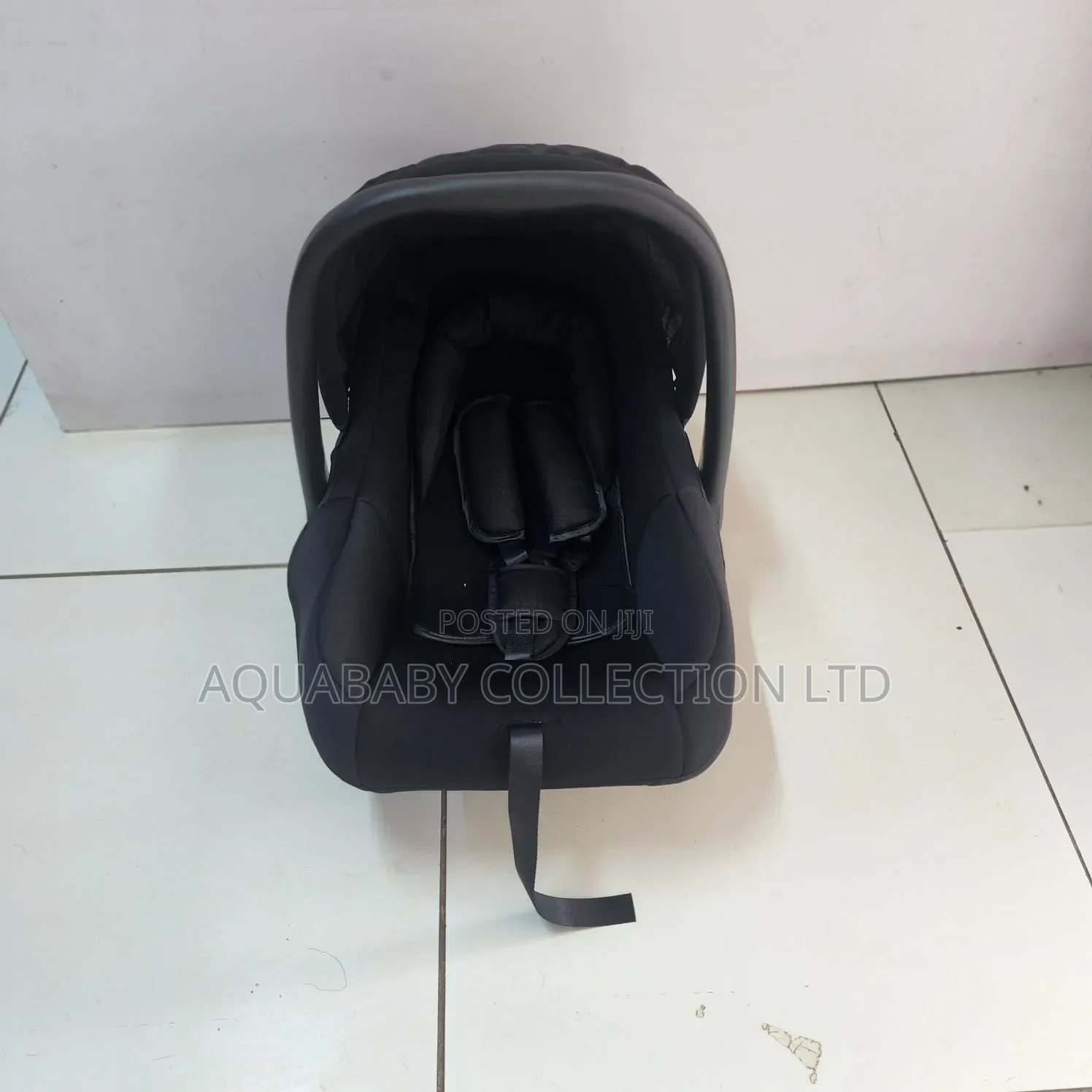 Black Carrycot, an Infant Carseat, and a Rocker