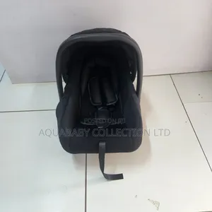 Black Carrycot, an Infant Carseat, and a Rocker