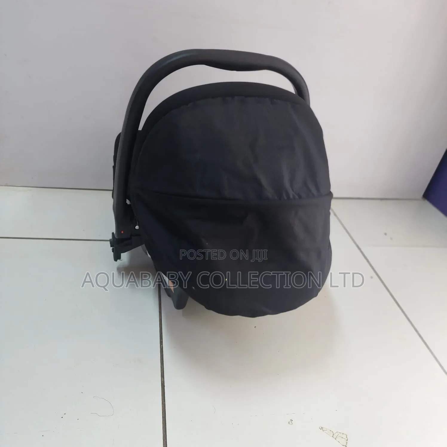 Black Carrycot, an Infant Carseat, and a Rocker