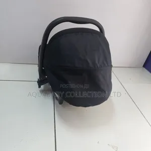 Black Carrycot, an Infant Carseat, and a Rocker