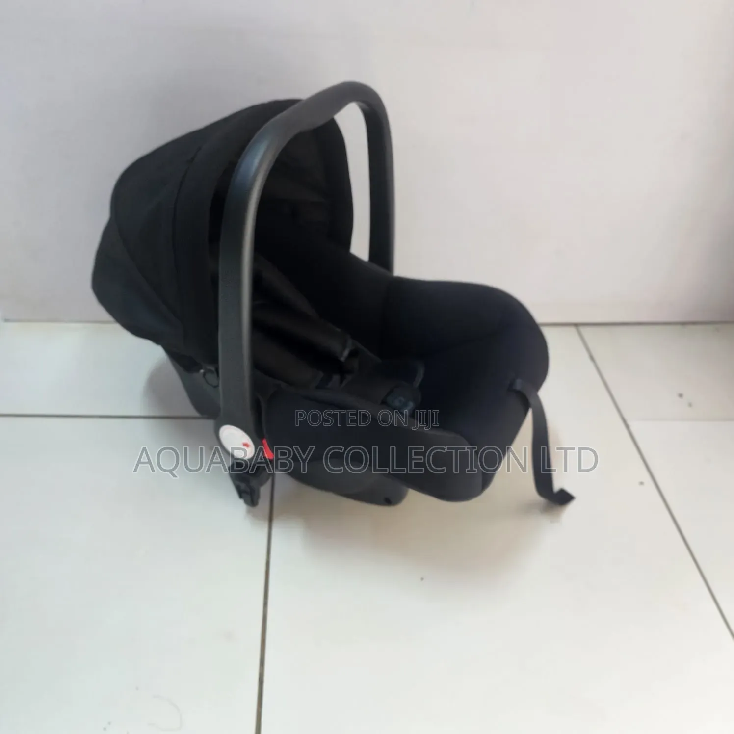 Black Carrycot, an Infant Carseat, and a Rocker
