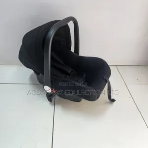 Black Carrycot, an Infant Carseat, and a Rocker