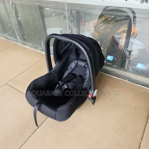 Black Carrycot, an Infant Carseat, and a Rocker
