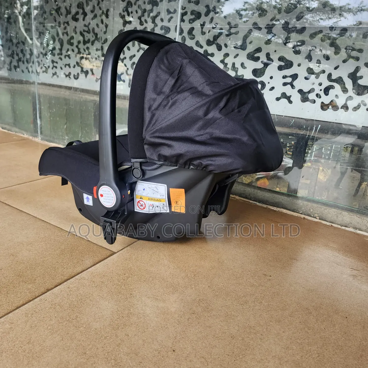 Black Carrycot, an Infant Carseat, and a Rocker