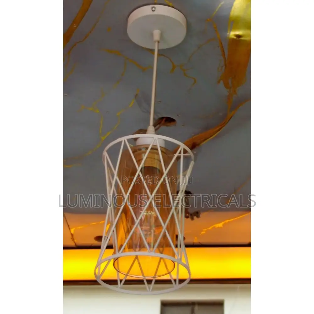 Sleek White Single Cage Pendant Light With Warm Amber Glass Shade