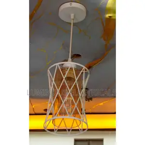 Sleek White Single Cage Pendant Light With Warm Amber Glass Shade
