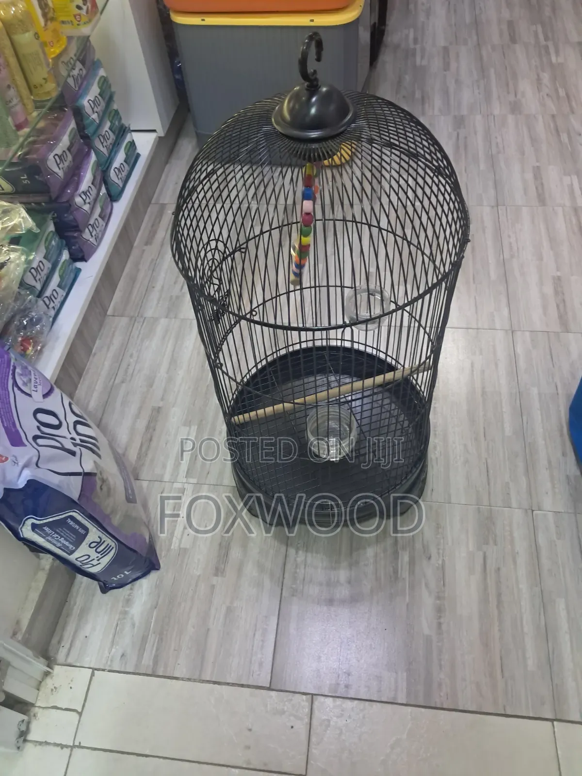 Round Metal Bird Cage With a Dome Top and Hanging Hook.