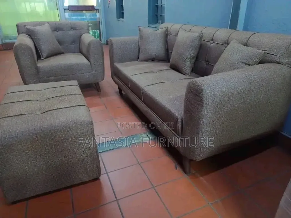 3 Seater Brown Tufted Sofa.