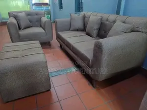 3 Seater Brown Tufted Sofa.