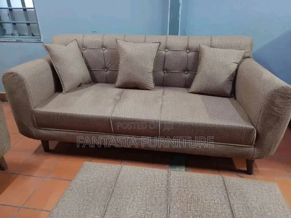 3 Seater Brown Tufted Sofa.