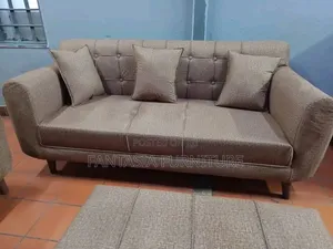 3 Seater Brown Tufted Sofa.