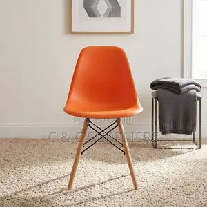 Plastic Orange Eames Dining Chair.