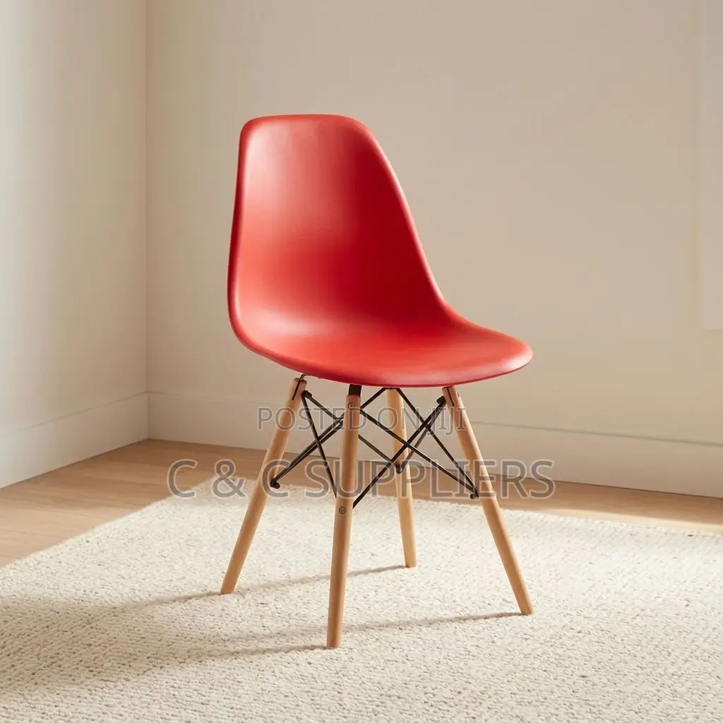 Plastic Orange Eames Dining Chair.