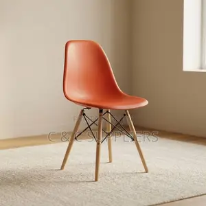 Plastic Orange Eames Dining Chair.