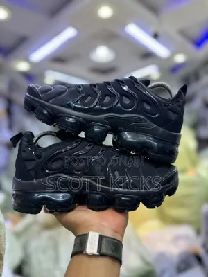 Nike Air VaporMax Plus Sneakers in a White and University Red